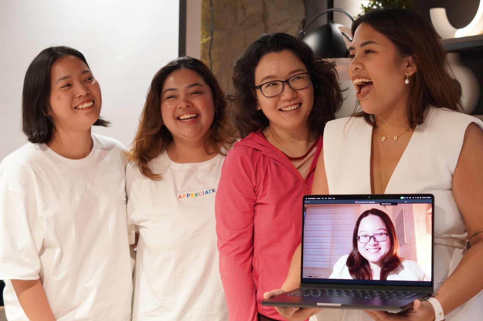 The Liberate community together, one member joining from a laptop